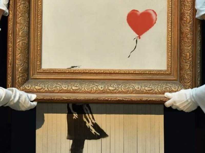 L'opera di Banksy &ldquo;Girl with Balloon&rdquo; nella sua versione triturata durante un'asta di Sotheby's lo scorso ottobre (foto LaPresse)