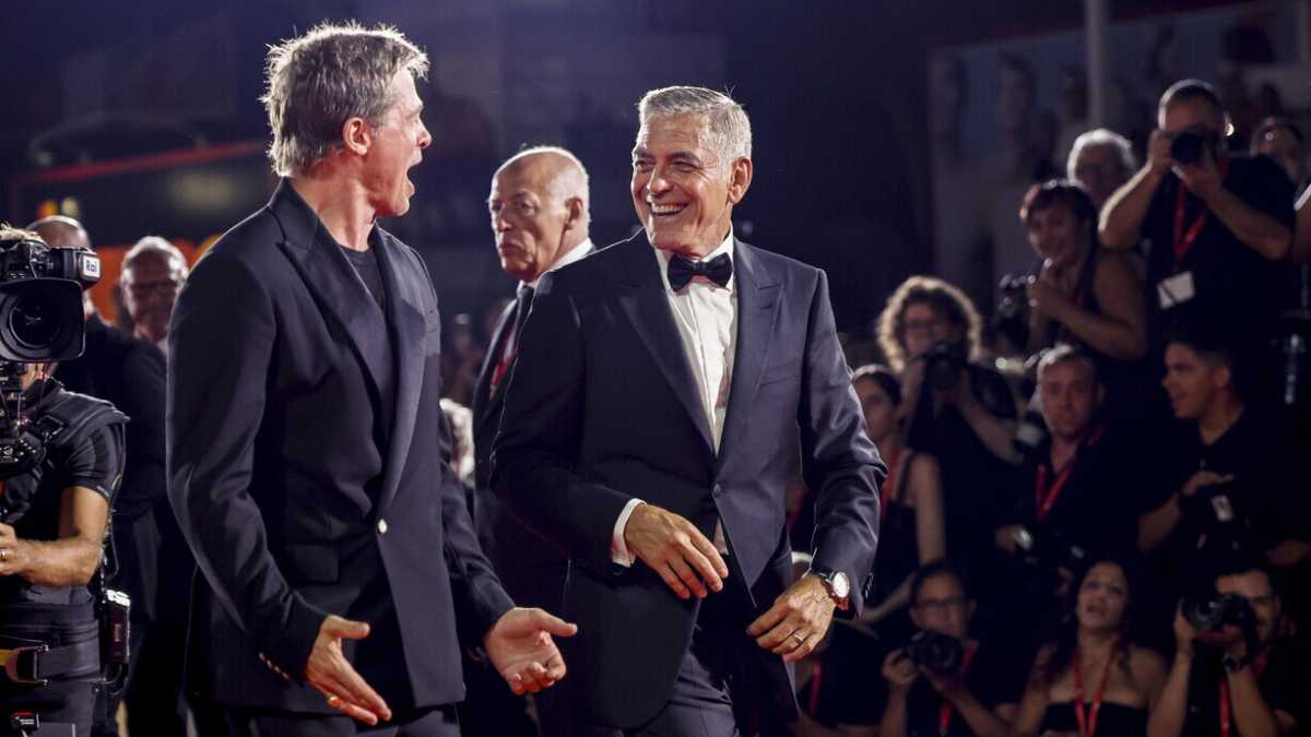 Immagine di Quattro lezioni più una apprese da Brad Pitt e George Clooney sul red carpet di Venezia