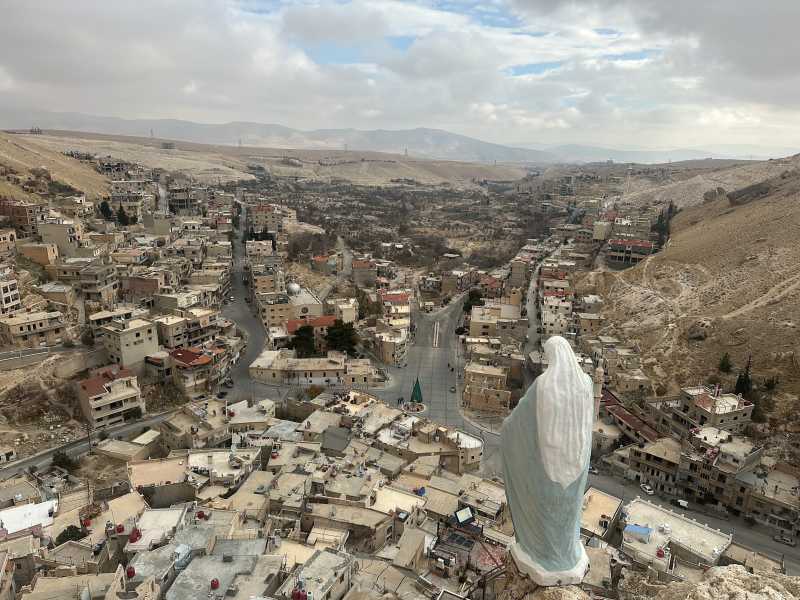 The statue of the Virgin Mary overlooking the ancient Christian town of Maaloula (photo by Luca Gambardella)