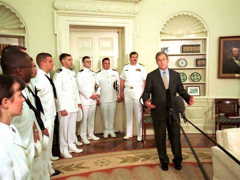 President George W. Bush (R) giving speech in the Oval Office of the White House after greeting the crew of the Navy surveillance plane that was held on China's Hainan island. (Photo by Mai/Getty Images)