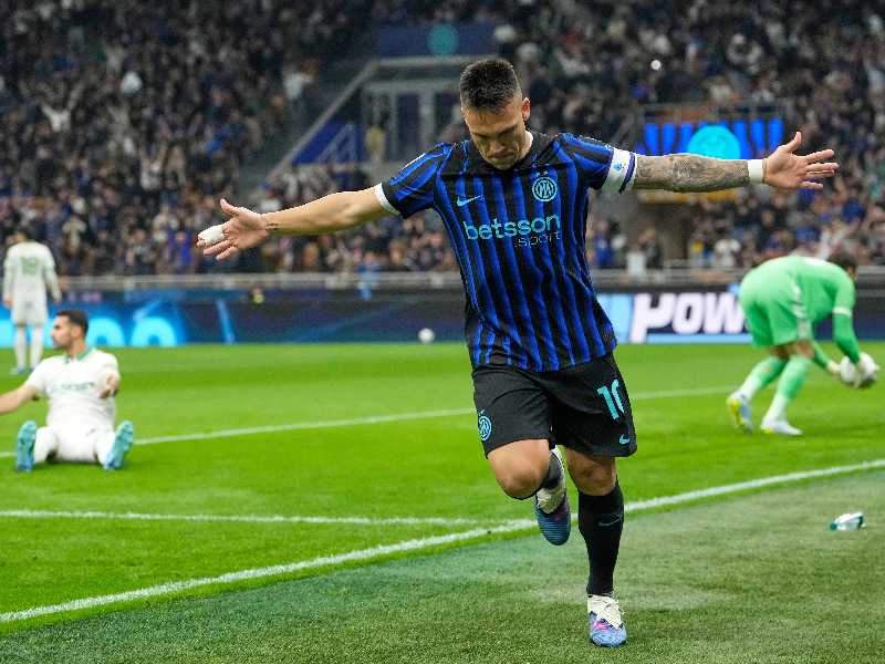 Inter Milan's Lautaro Martinez celebrates after scoring his side's opening goal during the Serie A soccer match between Inter Milan and Roma in Milan, Italy, Sunday, April 5, 2026. (AP Photo/Luca Bruno)