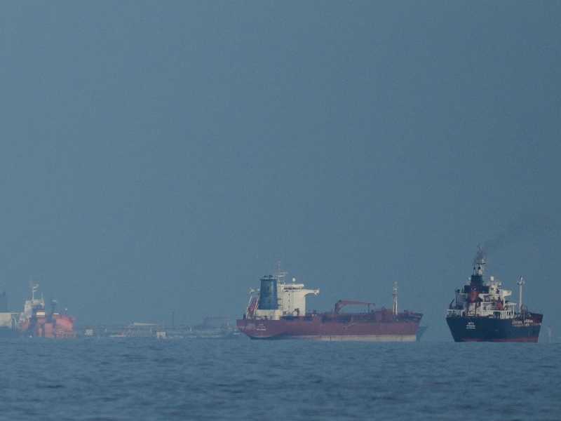 FILE - Oil tankers and cargo ships line up in the Strait of Hormuz as seen from Khor Fakkan, United Arab Emirates, Wednesday, March 11, 2026. (AP Photo/Altaf Qadri,File)