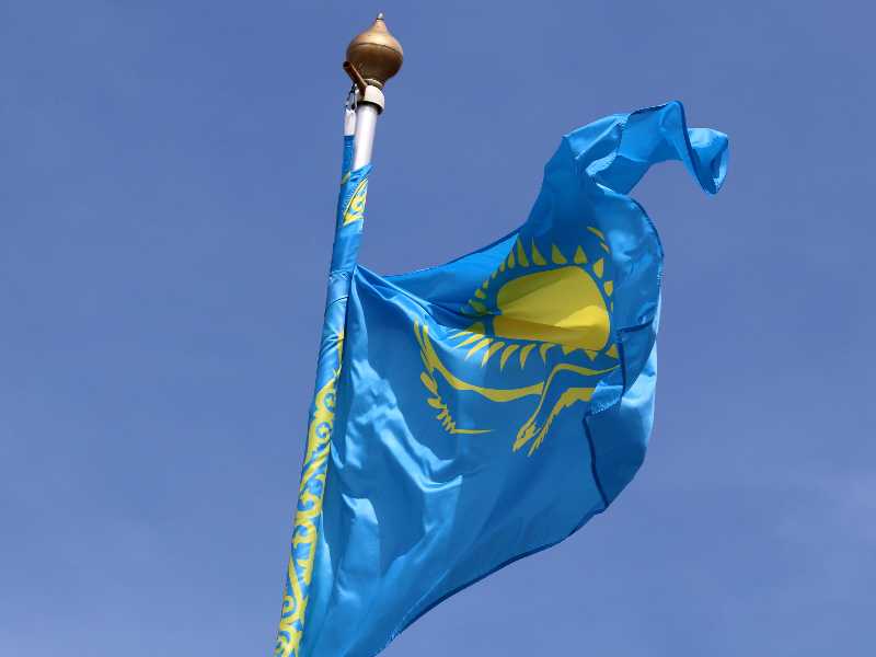 SAINT PETERSBURG, RUSSIA - 2025/06/20: The Kazakhstan national flag flutters in the wind on a flagpole. (Photo by Maksim Konstantinov/SOPA Images/LightRocket via Getty Images)